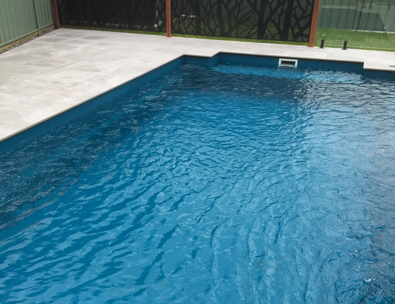 A balanced fibreglass pool with clear water after a step-by-step chemical routine
